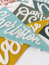 Load image into Gallery viewer, traveldashery - Custom city / state / location pennant: Mix of colors (add details to custom box) / I understand the current lead time for my order